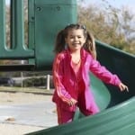 student standing on slide