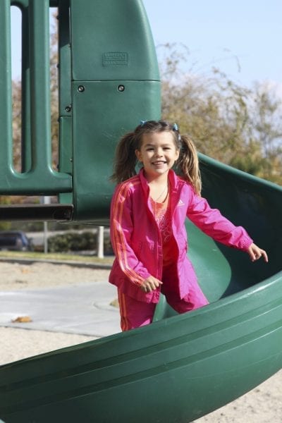 student standing on slide